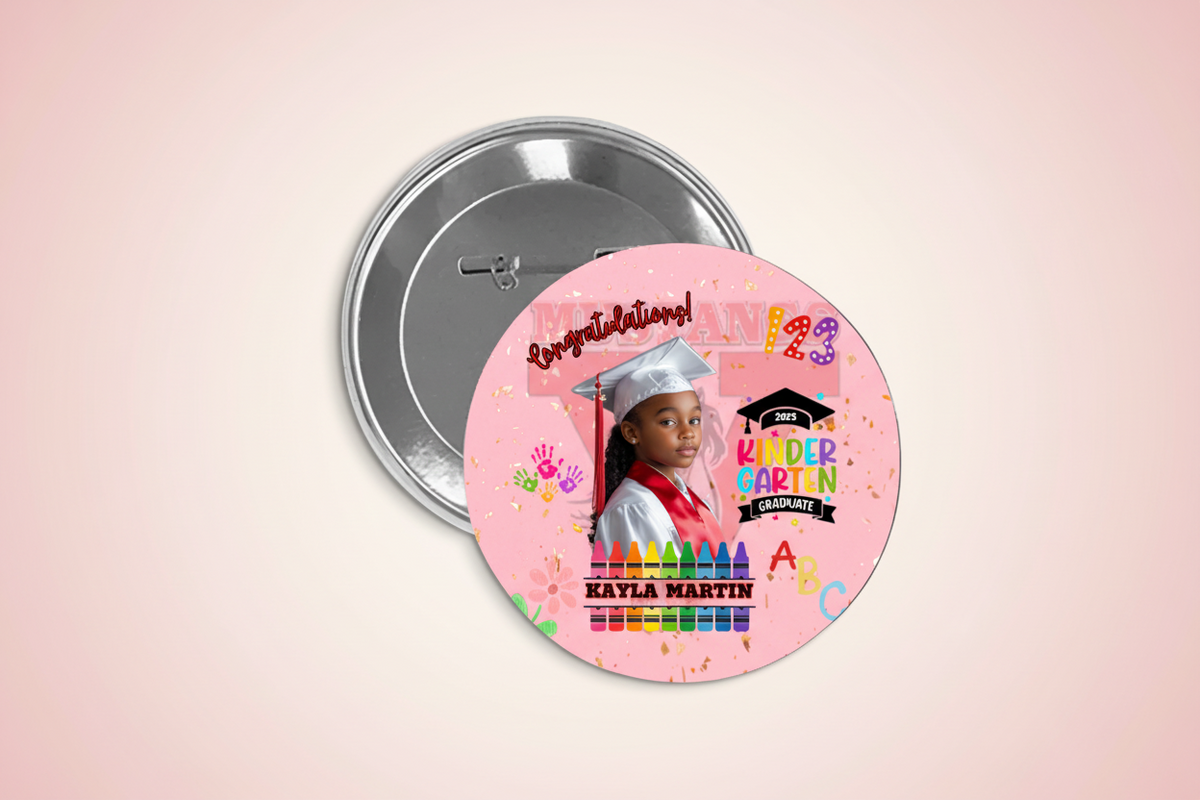 A custom graduation button featuring a photo of a graduate, school name, and graduation date on a pink background with decorative elements.